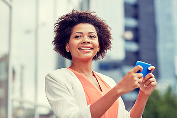 Image showing happy african businesswoman with smartphone