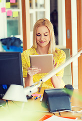 Image showing happy creative woman with tablet pc at office