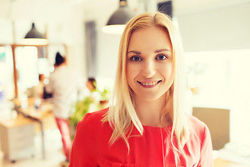 Image showing happy creative woman at office or bureau