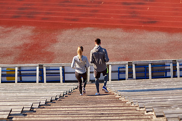 Image showing couple walking downstairs on stadium