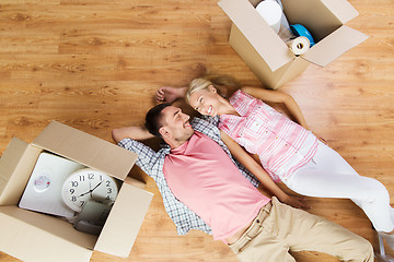 Image showing couple with big cardboard boxes moving to new home