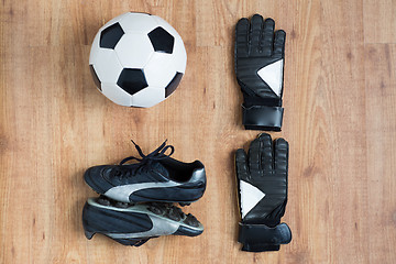 Image showing close up of soccer ball, boots and gloves