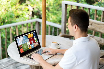 Image showing close up of businessman with laptop on terrace