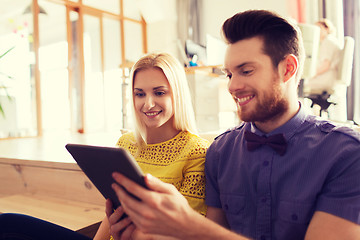 Image showing happy creative team with tablet pc in office