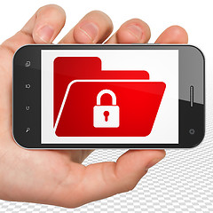 Image showing Business concept: Hand Holding Smartphone with Folder With Lock on display