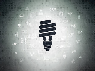 Image showing Finance concept: Energy Saving Lamp on Digital Data Paper background