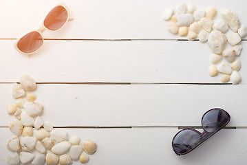 Image showing beach accessories on wooden board