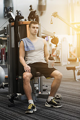 Image showing man exercising on gym machine