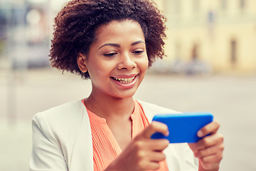 Image showing happy african businesswoman with smartphone