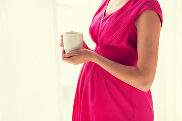 Image showing pregnant woman with cup drinking tea at home