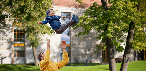 Image showing father with son playing and having fun outdoors