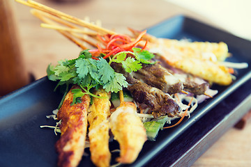 Image showing close up of deep-fried asian snacks on plate