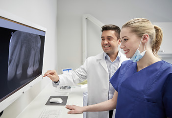 Image showing dentists with x-ray on monitor at dental clinic