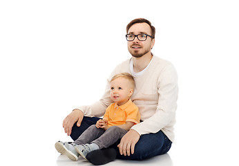 Image showing happy father and little son sitting together