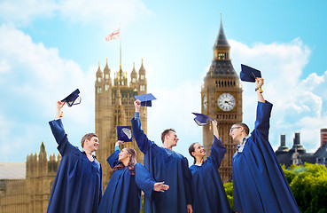 Image showing group of smiling students with mortarboards