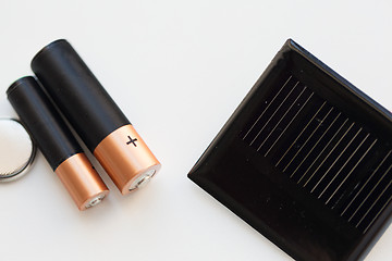 Image showing close up of alkaline batteries and solar cell