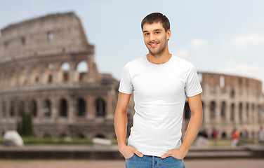 Image showing happy man in blank white t-shirt over coliseum
