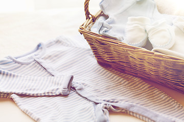 Image showing close up of baby clothes for newborn boy in basket