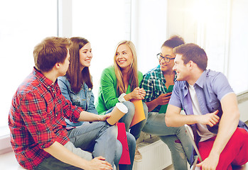 Image showing students communicating and laughing at school