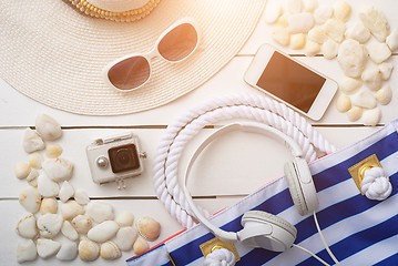 Image showing beach accessories on wooden board