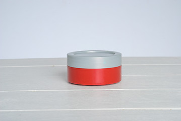 Image showing tib of face cream with red cover