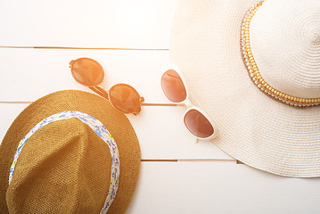 Image showing beach accessories on wooden board