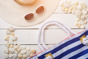 Image showing beach accessories on wooden board