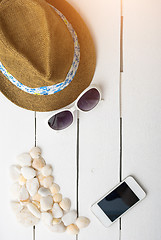 Image showing beach accessories on wooden board