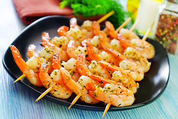 Image showing boiled shrimps are beaded on sticks