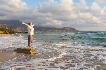 Image showing Free Happy Woman Enjoying Sunset on Sandy Beach