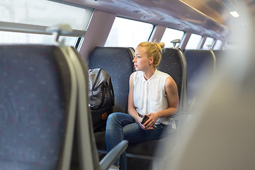 Image showing Woman travelling by train.