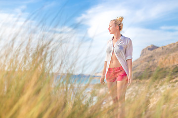 Image showing Free Happy Woman Enjoying Sun on Vacations.