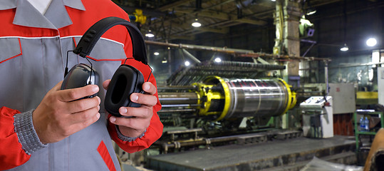 Image showing Worker with protective headphone