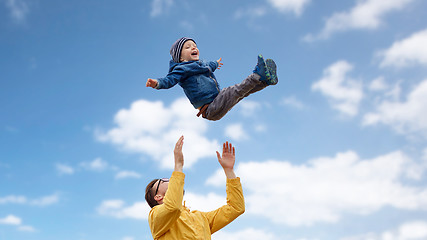 Image showing father with son playing and having fun outdoors