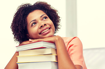 Image showing happy african student girl with books at home