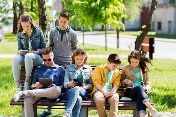 Image showing group of students with tablet pc at school yard