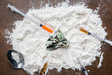 Image showing close up of cocaine drug, money, spoon and syringe