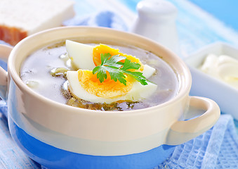 Image showing green soup with boiled eggs