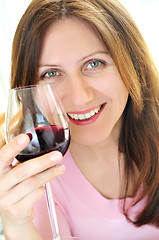 Image showing Mature woman with a glass of red wine