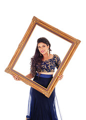 Image showing Pretty woman holding picture frame.