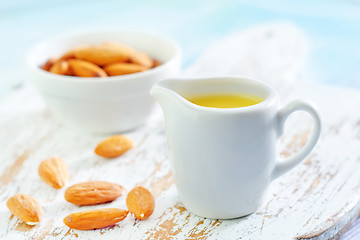 Image showing almond essential oil and almond in bowl