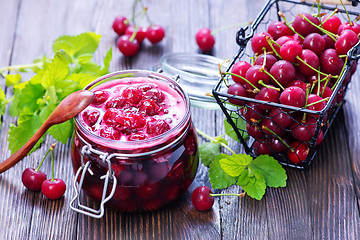 Image showing cherry jam and berries