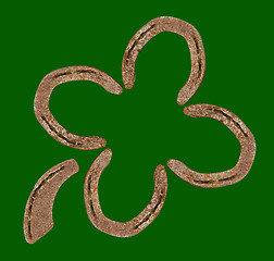 Image showing Horseshoes forming a clover leaf