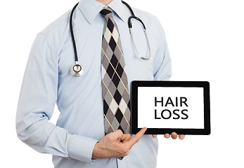 Image showing Doctor holding tablet - Hair loss