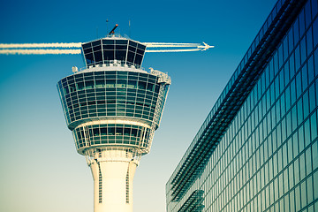 Image showing Flights management air control tower passenger terminal and flying plane