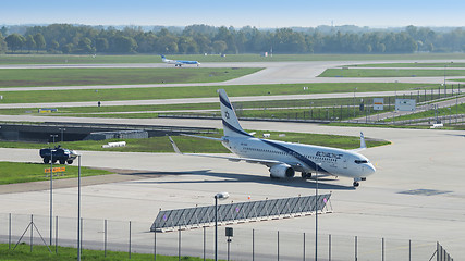 Image showing Israeli airline El Al plane and security armored vehicle