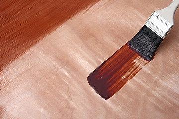 Image showing Fresh paint on wooden surface