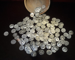 Image showing silver coins on black