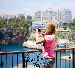 Image showing young woman with camera