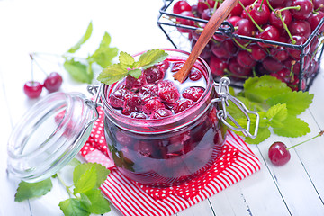 Image showing cherry jam and berries